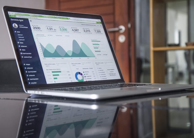 open laptop with a financial chart displayed